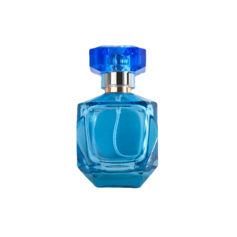 Bottiglie di profumo spray in vetro blu vuote che imballano una bottiglia di vetro