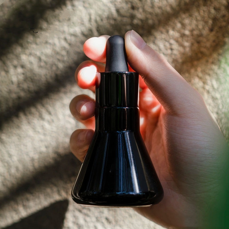 Imballaggio cosmetico per bottiglia di olio essenziale in vetro conico nero Imballaggio cosmetico per bottiglia di olio essenziale in vetro conico nero