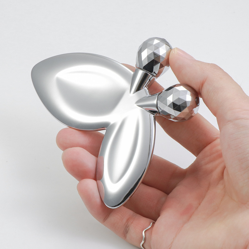 Rullo per massaggio facciale a forma di farfalla in lega di zinco Rullo per massaggio facciale a forma di farfalla in lega di zinco